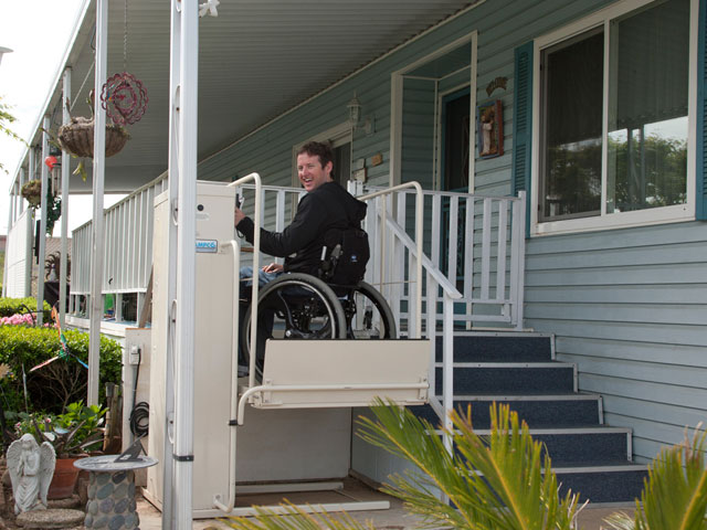 Vertical platform lift providing access to a porch